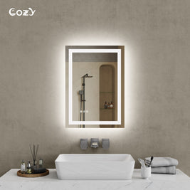 Cozy 20x28 inch backlit and front-lit LED bathroom vanity mirror in a modern setting.