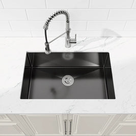 Top-down perspective of Cozy 30-inch matte black undermount single bowl handmade kitchen sink integrated with white countertop