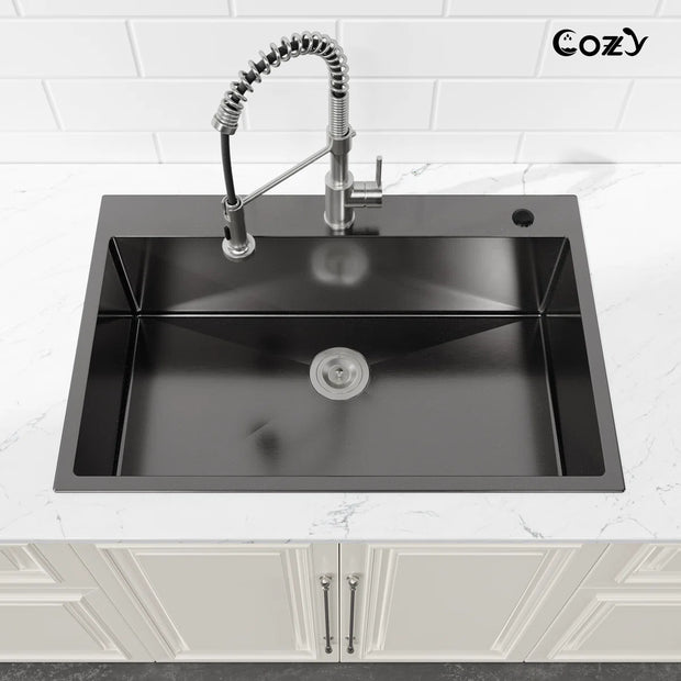 COZY 33-inch drop-in matte black single bowl kitchen sink installed in a countertop.