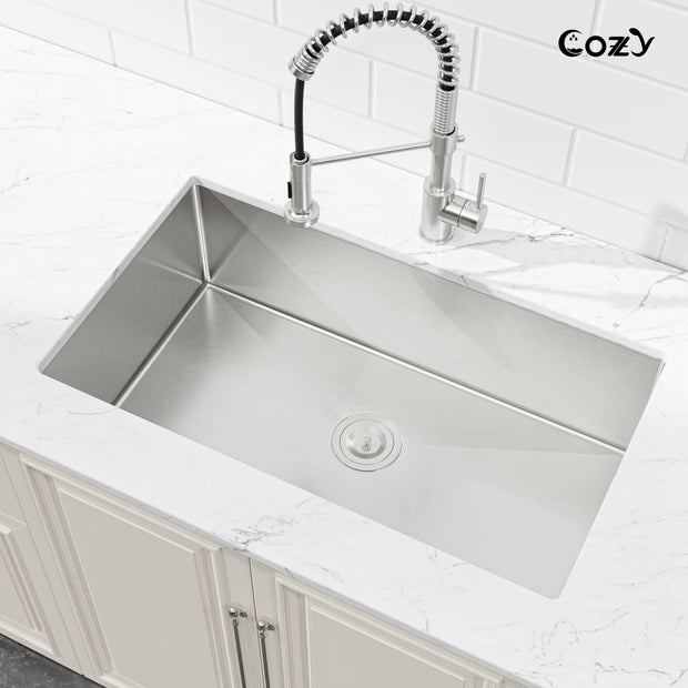 Cozy 33-inch stainless steel undermount kitchen sink installed on countertop