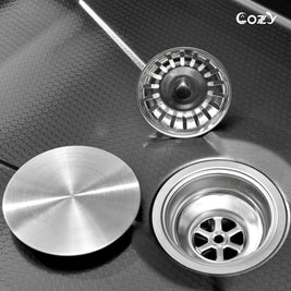 Cozy 33-inch black drop-in workstation single bowl kitchen sink showing stainless steel basket strainer and drain assembly