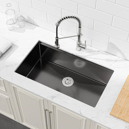 COZY 36-inch undermount matte black single bowl workstation kitchen sink installed in a countertop.