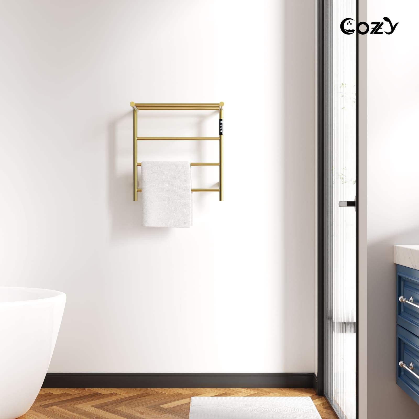 Cozy EB02 electric heated towel rack with shelf in brushed gold installed in a modern bathroom.