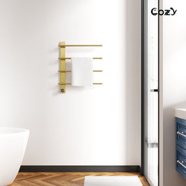 Cozy EB04 electric heated towel rack in brushed gold installed in a modern bathroom.