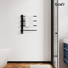 Cozy EB04 electric heated towel rack in matte black installed in a modern bathroom.