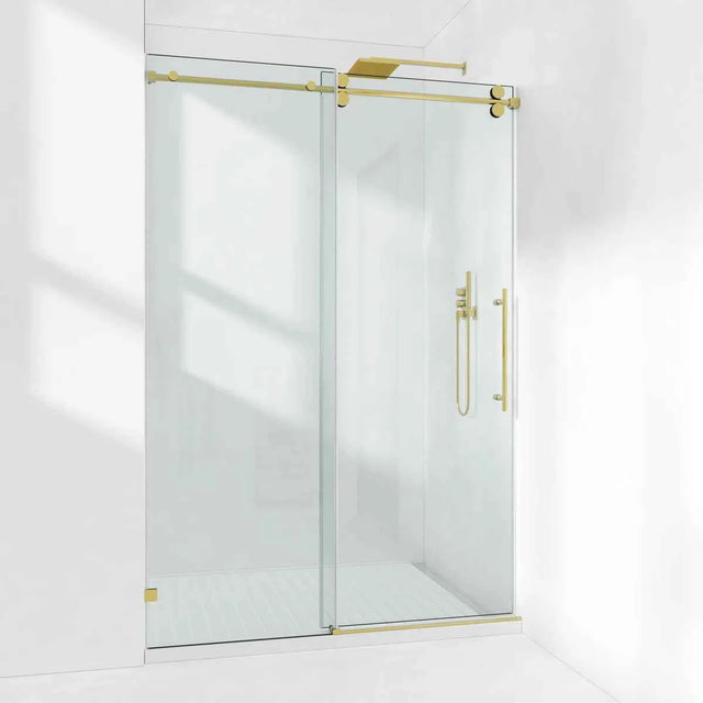 Cozy GD10-5476 Brushed Gold frameless single sliding shower door installed in a bright shower alcove.