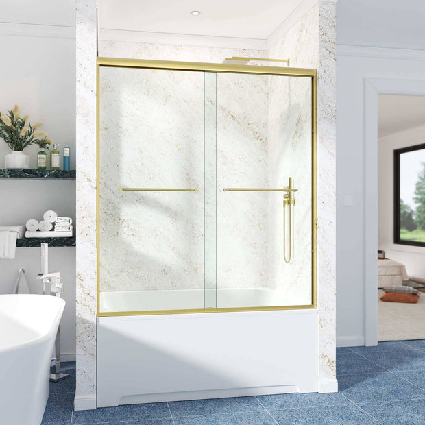 Cozy GD15 Brushed Gold semi-frameless double sliding tub door installed above a bathtub in a bright tiled bathroom.